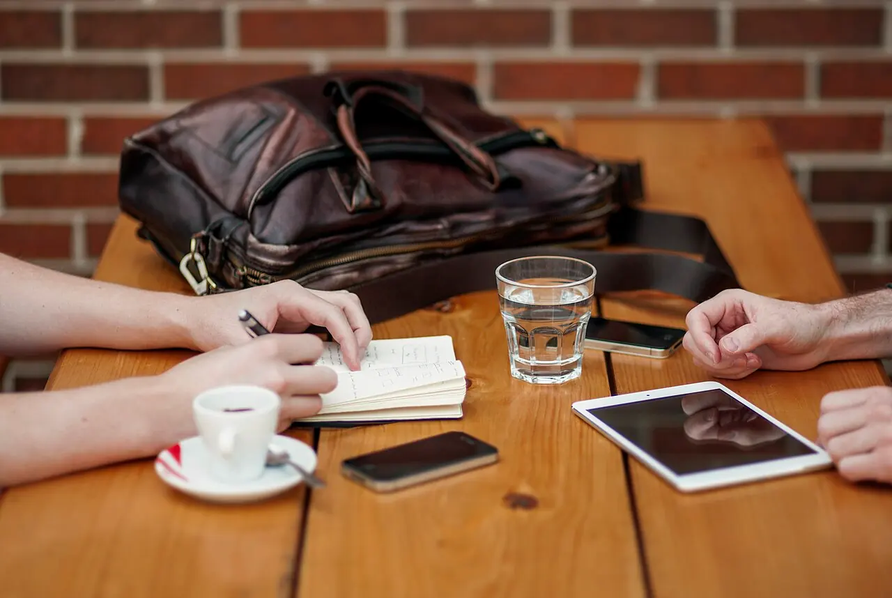 Notebook, phone and tablet on a work table